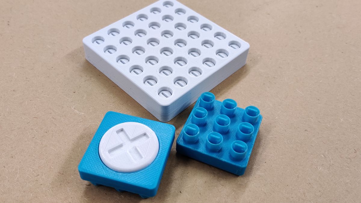 3D printed sample of the board and a module.