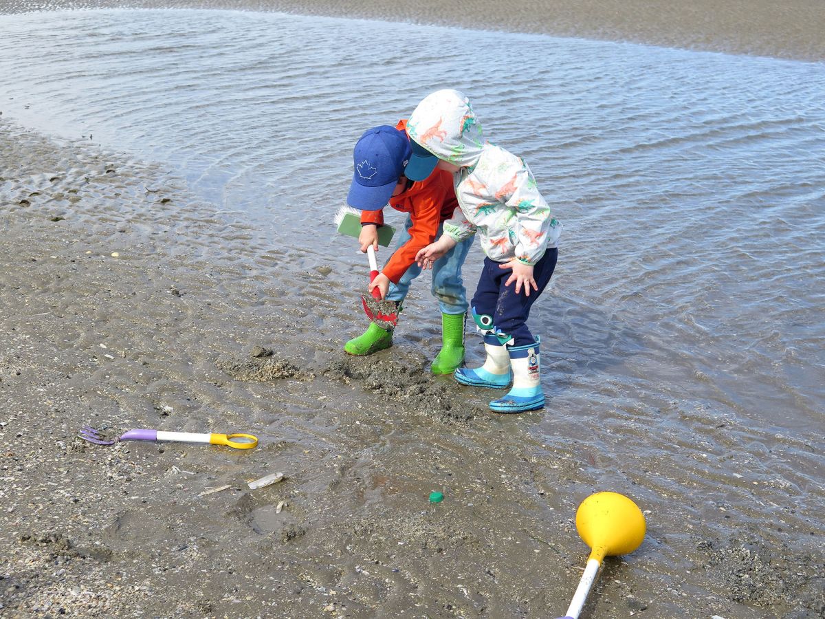 Combo being used by siblings aged two and four on the beach. This shows the social aspect to combo that can encourage teamwork and social interaction while also facilitating independent play