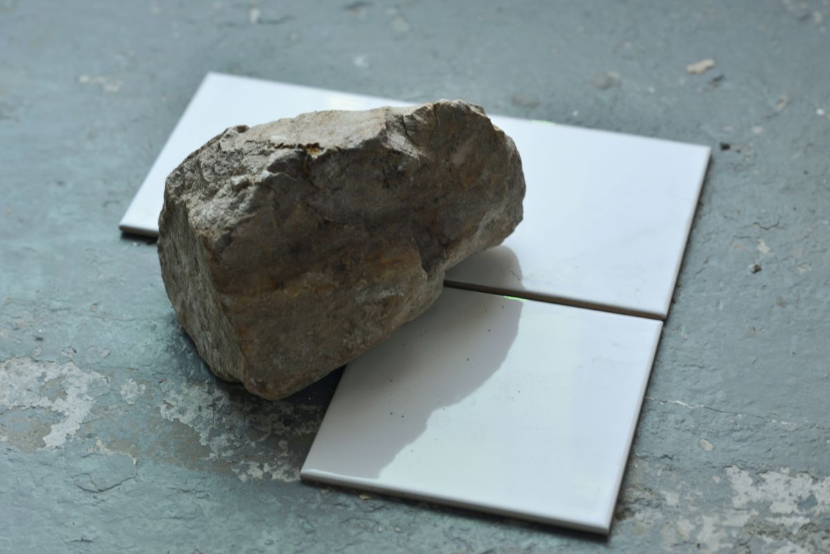 Close up view of a tile and rock installation