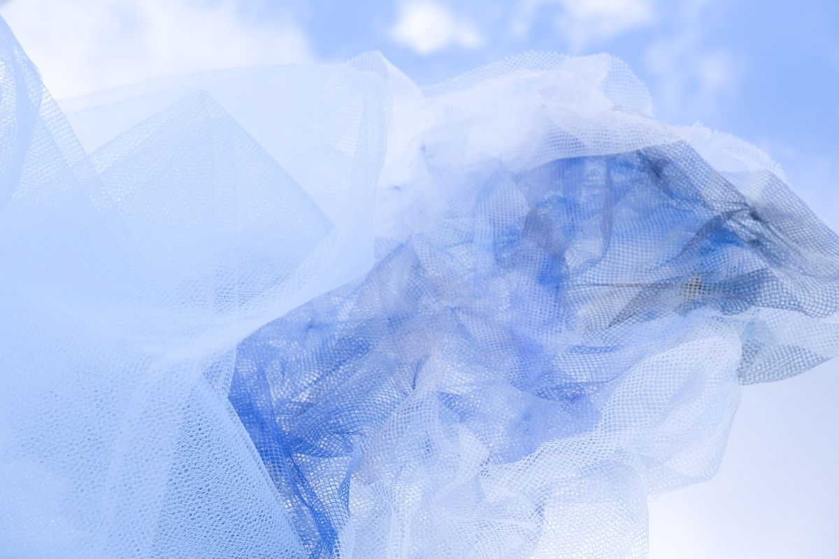 Cumulonimbus Cloud Association. Transfer printed tulle, smocked to represent the irregular placement of clouds