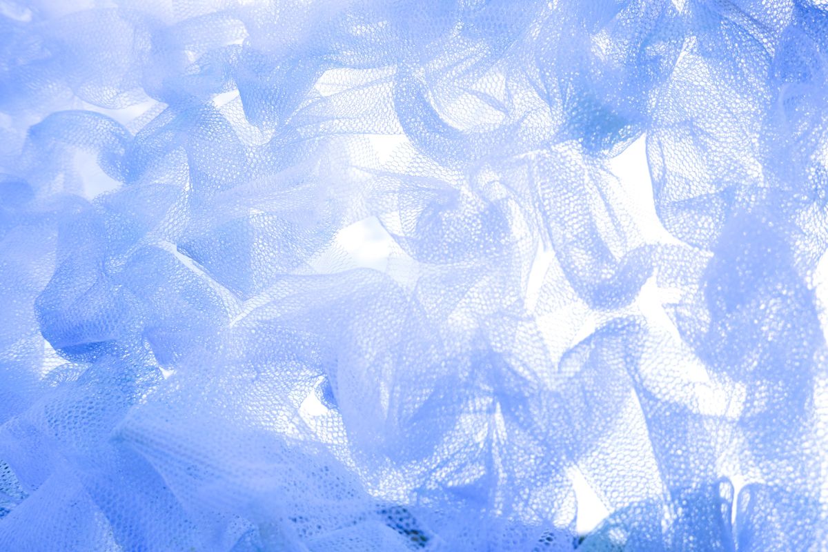 Cumulus Cloud Association. Transfer painted on to net, cut up and knit with my arms
