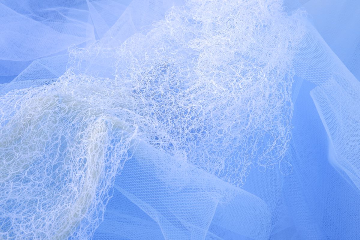 Cirrus Cloud Association. Hand knit transparent sections linked on to a knit base
